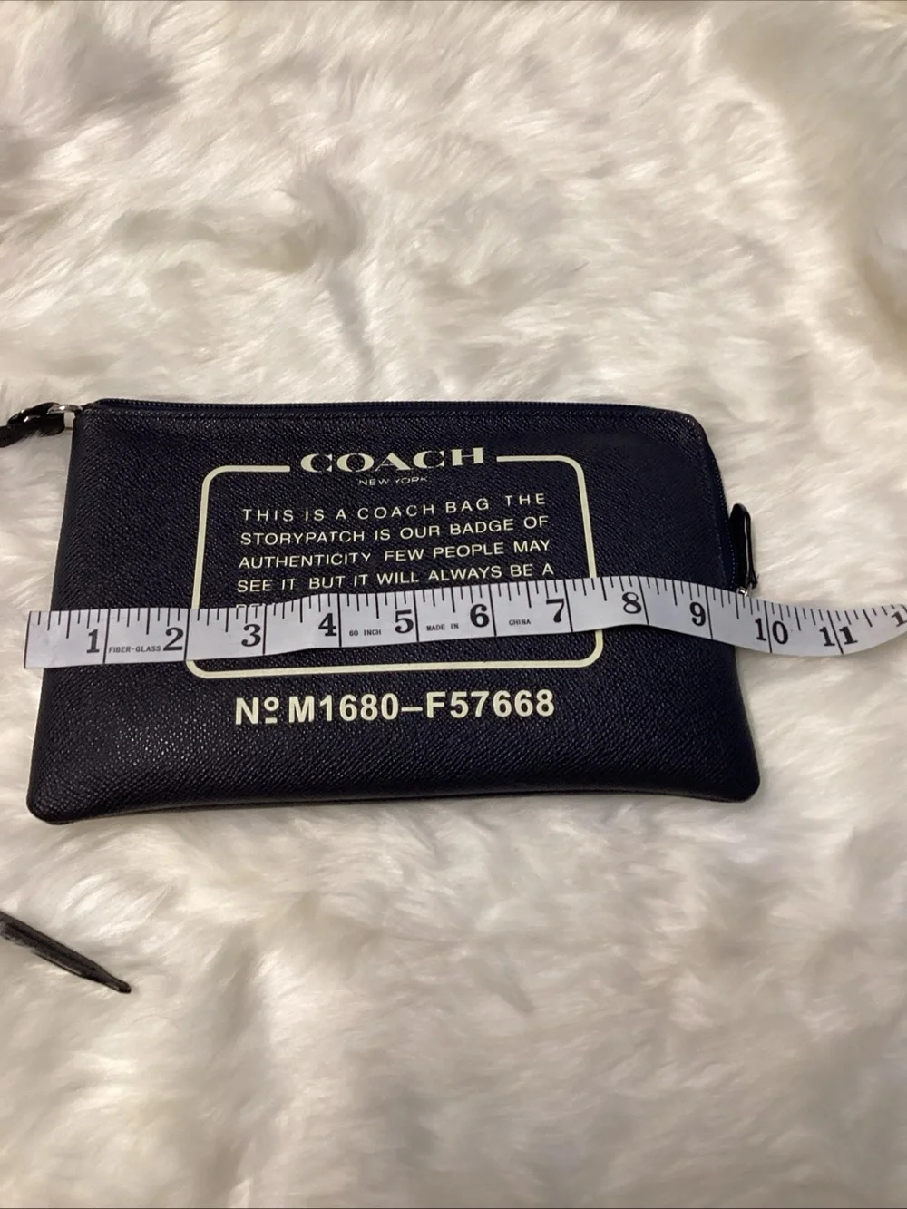 Coach Navy Wristlet with Cream Logo Text